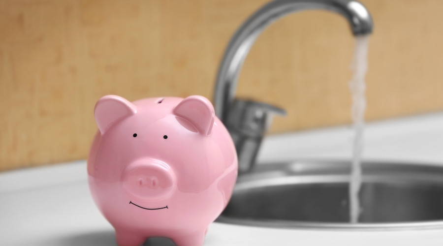 Pink piggy bank and faucet, symbolizing savings for PAC Plumbing, Heating, Air Conditioning services.